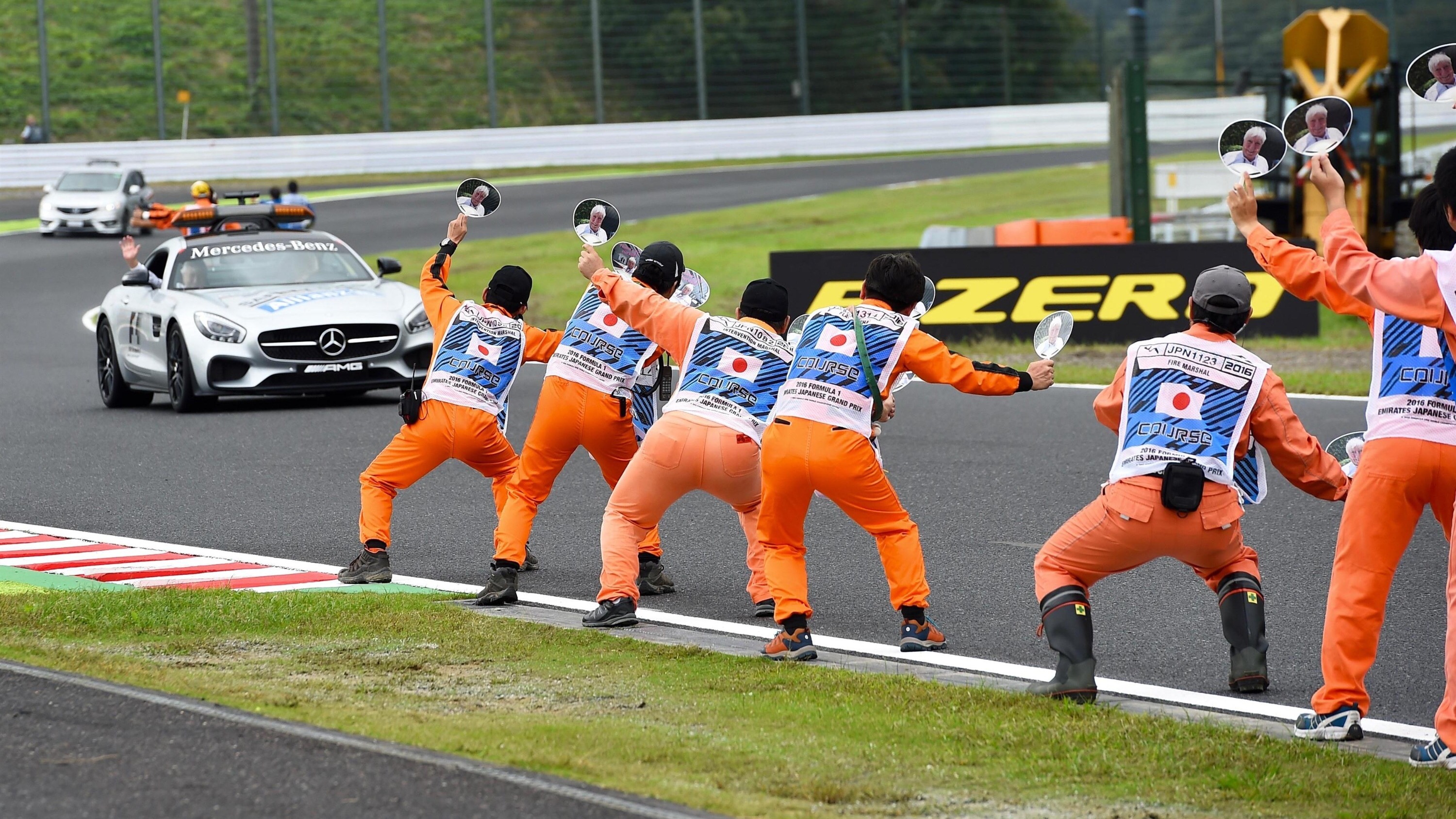 Marshals wave banners for Herbie Blash (GBR) FIA Delegate at the safety car at Formula One World Championship, Rd17, Japanese Grand Prix, Qualifying, Suzuka, Japan, Saturday 8 October 2016. © Sutton Images